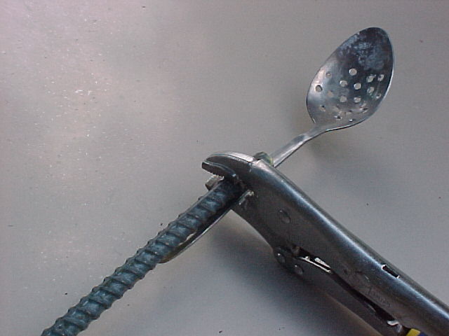 makinbg a skimmer with a spoon